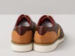Chaussures derby tressées bicolores en cuir marron et beige