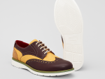 Chaussures derby tressées bicolores en cuir marron et beige